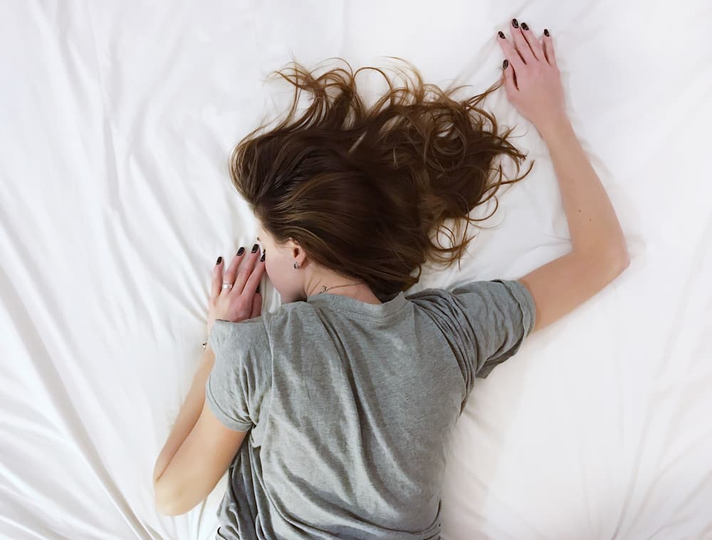 a woman sleeping face down